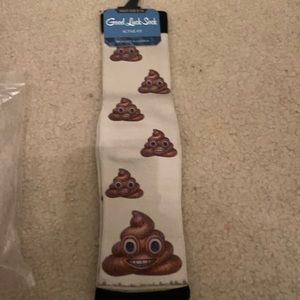 Pair of socks with poop emojis. good luck socks